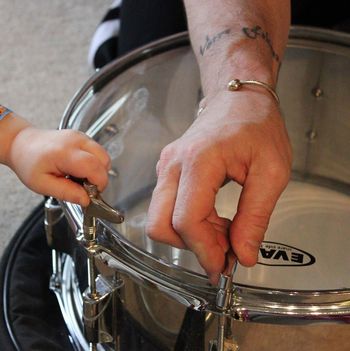 Dylan helping me change some drum heads
