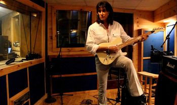 Punky Meadows recording guitar tracks.
