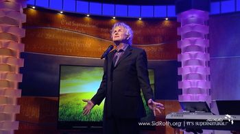 Phil performing on the Sid Roth It's Supernatural Show in 2016
