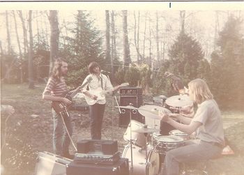 Lacewind, post-Michael, on an unseasonably warm day in the Spring of 1972. Here we find, left to right, yrs. truly (guitar), Russel Lloyd (?) (guitar), Alan St. Thomas (bass) and Scotty K. (drums). Barely visible at far left is the hand of Larry Gallat setting up his Farfisa. I was in full Allman Brothers mode at this point, working hard to nail "In Memory of Elizabeth Reed" and learning all I could about slide guitar from Honest Tom Pomposello at Kropotkin Records. I remember the first realization that I was hitting a wall with other musicians when neither Russel nor Alan could wrap their heads around the Liz Reed thing.
