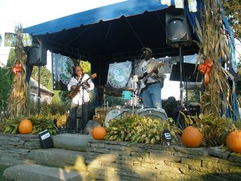 The stage accepts the Rhythm Kings. The band plays to their special guests, the pumpkins and the cornstalks. Note the GUESTBOOK on the steps. If you're in that book, you're probably looking at this picture.
