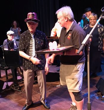 Bob Kissel gives Bob Seeley a 90th birthday cake
