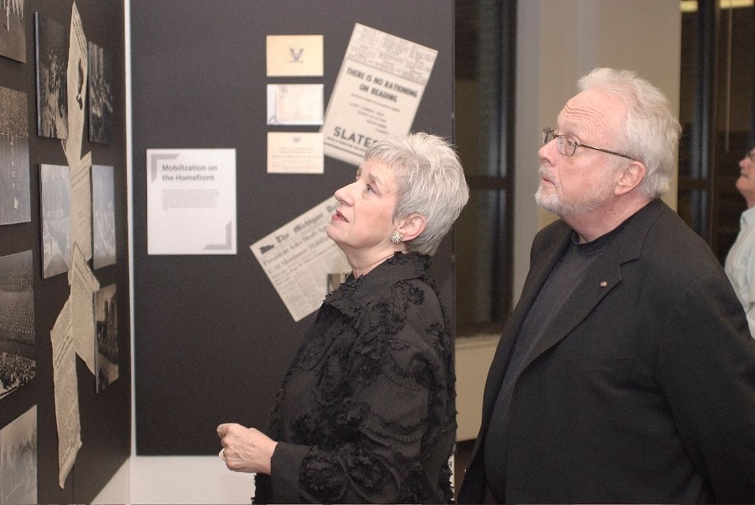 Joan and Bill viewing an exhibit of World War II material related to Ann Arbor and the University of Michigan prior to their concert on Nov. 11, 2009, at the UM Graduate Library.
