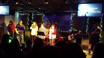Landry and Cardis with the worship band at Mid-Winter Retreat at Camp Clearwater in Turkey Creek, La.
