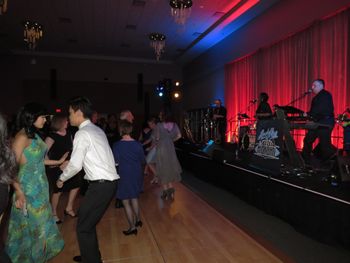 Corporate guests filling the dance floor.
