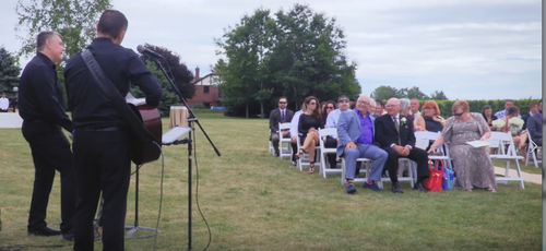 Sandy Vine Contemporary Ceremony Duo performing relaxing music for seated guests prior to the start of a wedding ceremony.