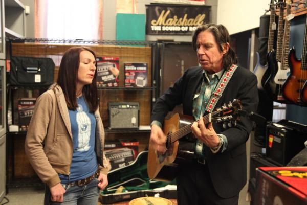 Catherine and John Doe singing a song together in the pilot of  "American Music."