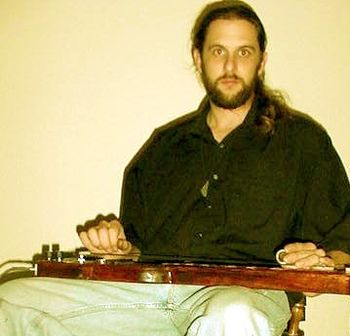 Scott with his homemade lap steel in the studio.
