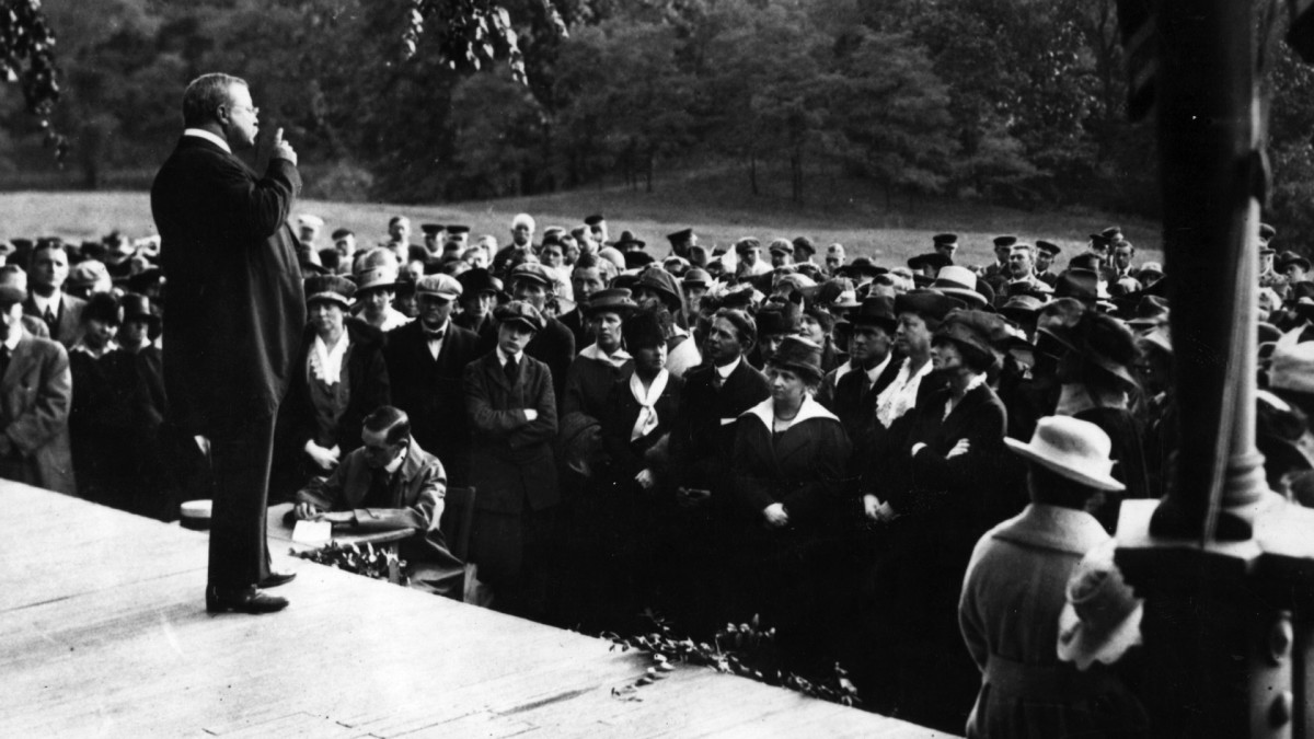 President Theodore Roosevelt addressing a suffragist rally from the verandah of his home, c. 1905.