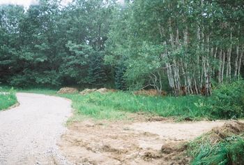 more driveway with ramp for the heavy equipment to the right
