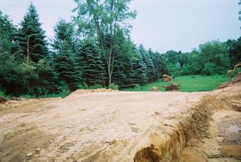 facing south by end of garage
