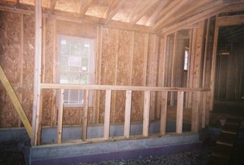 garage window with rail along basement steps
