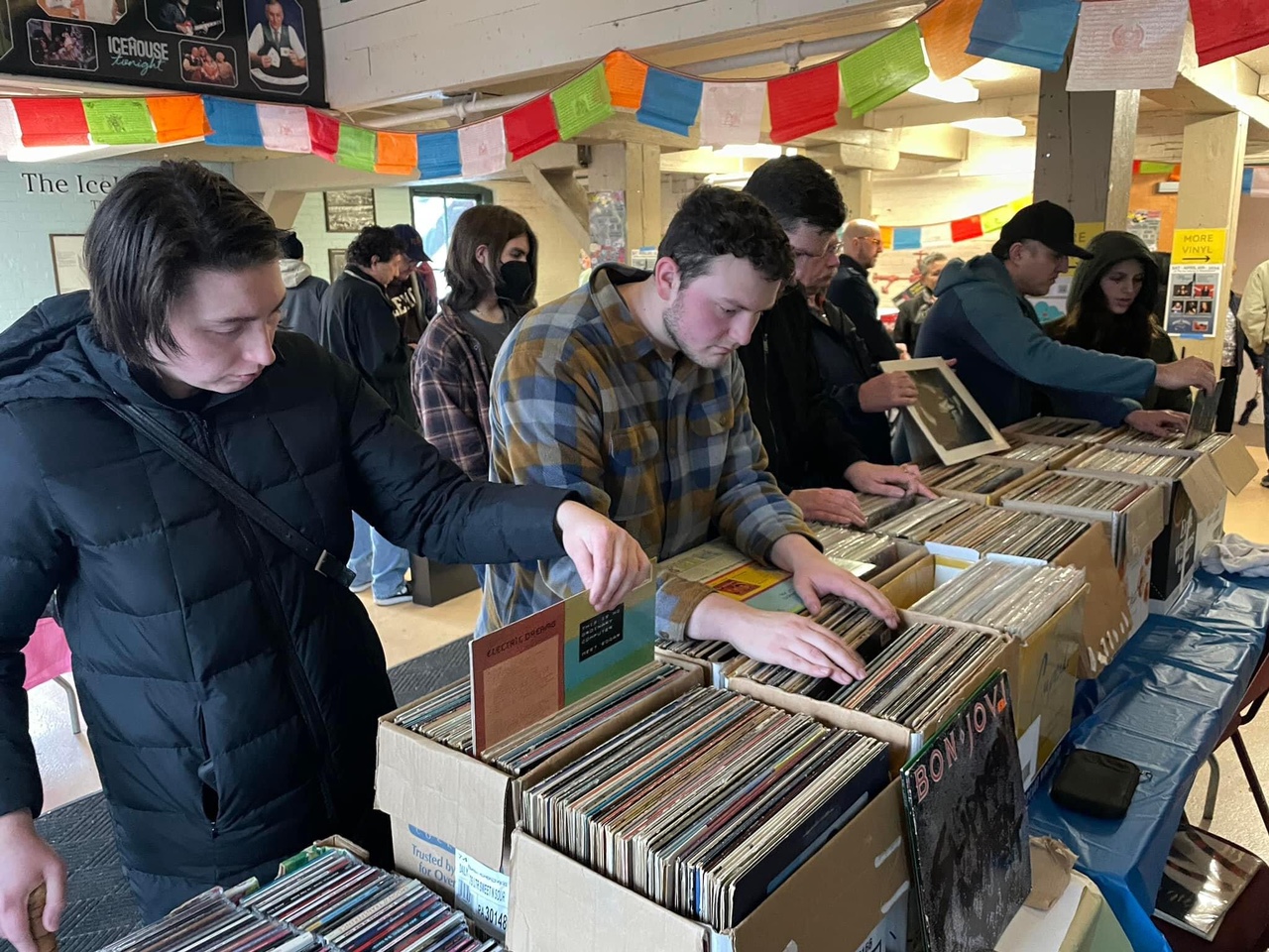Lehigh Valley Community members browse Vinyl records at Lisa Bodnar and Whistlegrass OM FROM THE VINYL GARDEN event at the Icehouse in Bethlehem