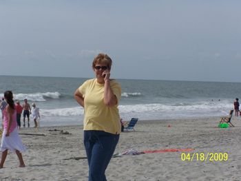 Got to have that cellphone even on the beach!
