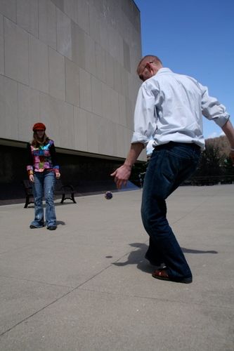 hacky sack on the front porch of the Capital Arts Complex
