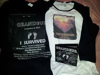 Photo post by fan, Sue Anderson in Michigan - "I got my baseball style Grandeur tee shirt!!! Pictures do not do it justice, it's beautiful like the band that is represents!!! Love it!!! Great CD is signed by the entire band! Here's my Grandeur collection so far!!!"
