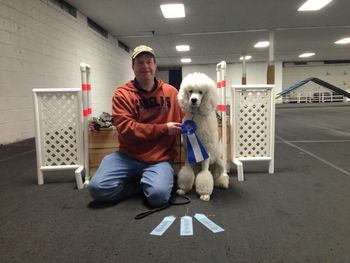 Bentley and his trainer and owner Taylor when they gained their UKC Level 1 Agility title in 2013
