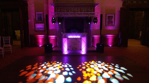 DJ Ricky Gold DJing a Wedding at Macdonald Elmers Court Hotel & Resort, Lymington. "Golden" package with video, branding board, uplighting and dance floor lighting.