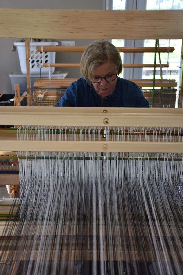 Kate creates towels on her loom, an eight-shaft Leclerc Colonial