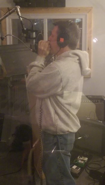 Laying down the harmonica track
