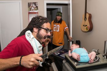 Jon Ditty about to eat DJ D-Rok's son, Sebastian (Photo by Grind & Press Photography)

