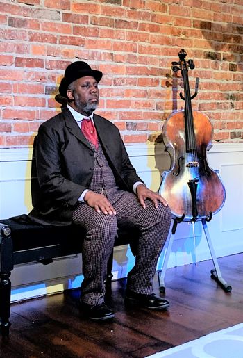 Elbert (Anthony Floyd) with Eli's cello
