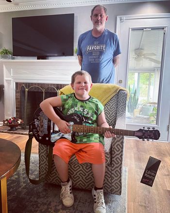 Mark Henes with guitar student Chris Jr.
