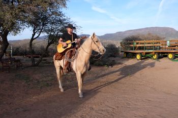 Doin' my singin' cowboy bit on my friend's little ranch in Prescott Ridge, AZ. That's TJ I'm on, a 4-year old gelding who I was working with at the time. Photo by Cynthia Roche
