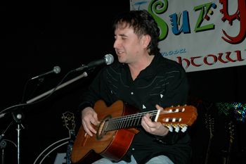 Suzy’s in Hermosa Beach, California.  Playing my beautiful Candelas Brothers classical guitar that was stolen in a studio theft, I miss her so…  I'm still lookin' for ya baby, come back!!!   Photo by Dan Franzen
