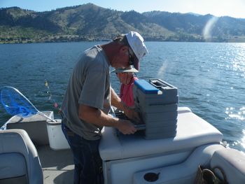 Jul 2009, Dan's first fishing trip in 4 years...which hook should he use? Holter Lake, MT
