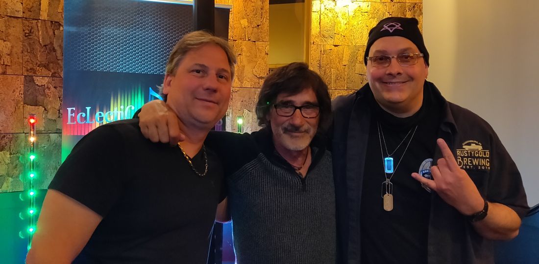 With "Donnie Iris"
