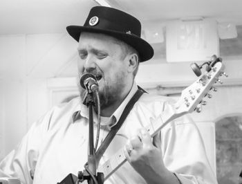 Scott Heller- vocals and cigar box guitar
