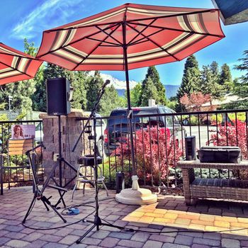 Setting up for Fernanda Froes-Pruett live at the Tree House Patio, in Mount Shasta, California.
