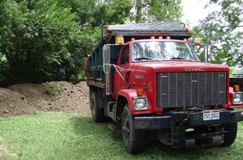 One of our dump trucks delivering topsoil.
