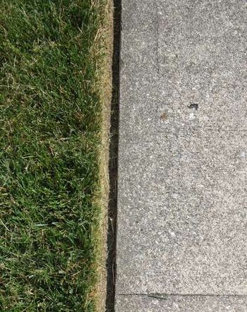 Closeup of customers'edged sidewalk that we maintain weekly.
