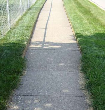 Our edging is in the distance, the foreground is another property. Edging needs to be done often to maintain a sharp look. Most of our customers have it done every time we mow.
