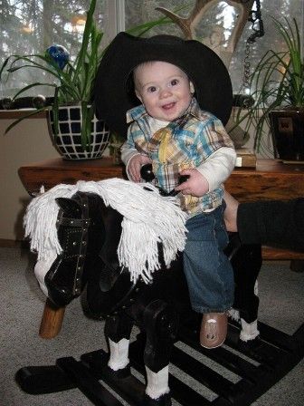 Our little buckaroo riding his horse Willy.
