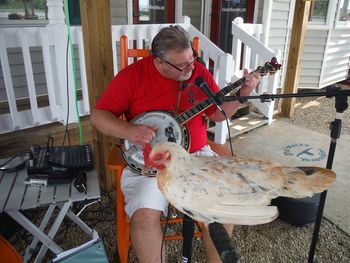 Papa Pickin with a Chicken
