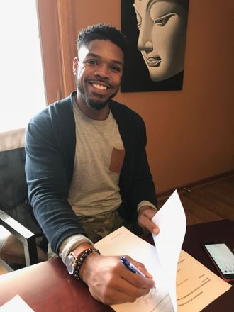 Signing my contract with a Cincinnati, Ohio based youth organization that allows for me to mentor 50 plus youth in middle and high school