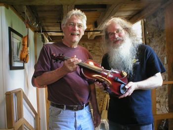 Guy Tomme of Delescluse Custom Guitar and Violin presenting Ted with the first Prototype of the official Ted The Fiddler Firecracker model custom Acoustic/Electric 5 String Fiddle... Violin if you prefer, although there's more beer spilled on a Fiddle.
