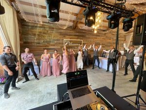 Wedding Party Dancing in a Half Circle with Bride and Groom