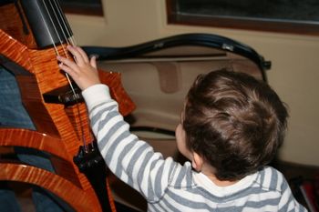 Nephew Tanor in awe of the 6 string electric cello
