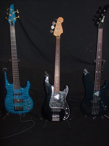 The Fretless Kids. L-R: Carvin 5 String, Custom Fender & Charvel 4 Strings
