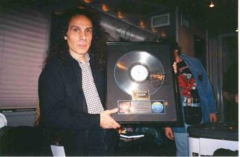 Ronnie was astounded by this gold "Last In Line" that I owned! He signed the front, "To Big Jim-How Do You Do It? Love Ya" on the Dio tour bus in 97.
