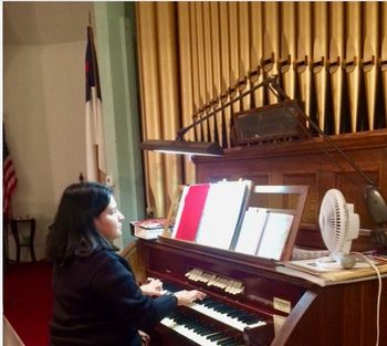 Rehearsing on the organ before a Christmas service at a First Congregational Church.

