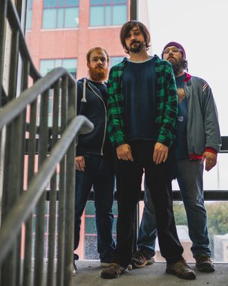 Lansing rock band Jenn's Apartment in parking garage stairs. Photo taken by Donte Smith