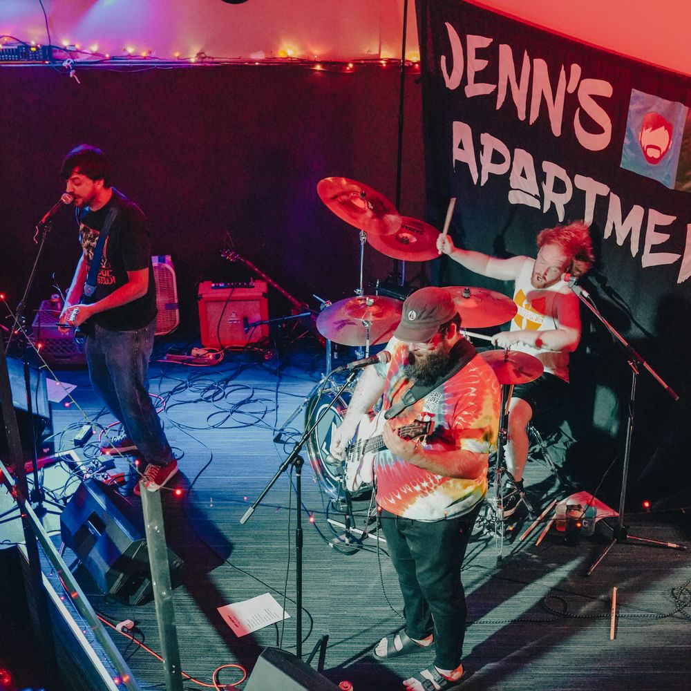 Roy Kirby, Justin Pine, and Chris Davis of Jenn's Apartment performing at The Avenue Cafe in Lansing, Michigan.