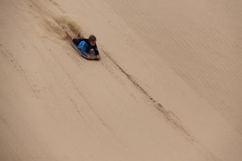 Mitch coming down the sand doon at 90 Mile Beach, Northland
