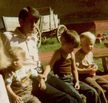 Paul holding his brother Brian's arm on a father and sons trip with his dad and brother David.
