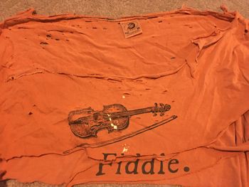 Long time favorite tee shirt was so holy it was approaching sainthood. Divine inspiration has given it a new life as a Bag-O-Rags mandolin strap.
